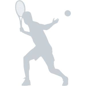 Silhouette of a tennis player in mid-swing with a racket, preparing to hit a tennis ball.